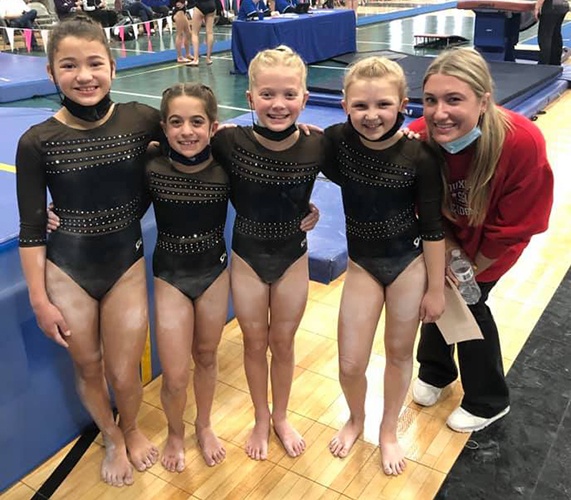 Girls and Coach Siouxland Gymnastic Academy