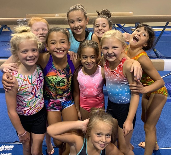Gymnasts smiling in big group